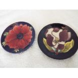 Moorcroft Pottery - two circular pin dishes decorated in a floral design 11.