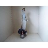 Lladro - a large retired figurine depicting a young girl with turkeys at her feet, 39 cm (high),