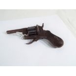 A 7mm pinfire 6 shot pocket revolver with folding trigger and checkered pistol grip ca 1850,