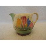 Clarice Cliff - a small cream jug decorated with Spring Crocus,