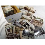 Over 600 largely early period UK topographical postcards to include transport,