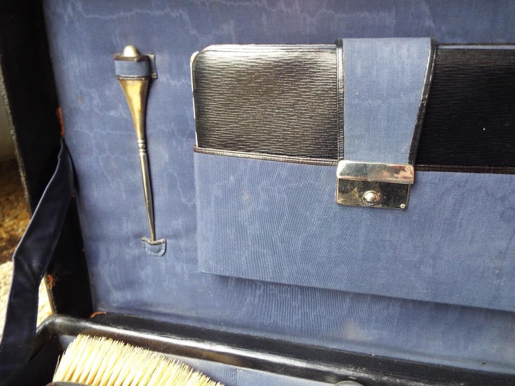 A black case with fitted interior containing a 15-piece vanity set with hallmarked silver mounts, - Image 5 of 11
