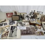 A large collection of vintage photographs depicting family, scenes, weddings,