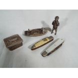 A small collection of white metal collectables to include a silver fruit knife with mother-of-pearl