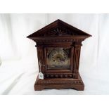 An oak cased Junghans bracket clock with striking gong,