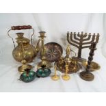 A good mixed lot of Middle Eastern brassware to include candlesticks,