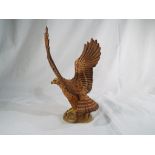 Beswick Pottery - a golden eagle finished in matt #2062, 24 cm (h).