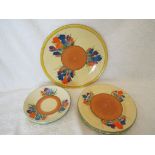 Clarice Cliff - nine pieces of tableware decorated in the Crocus pattern comprising four saucers,