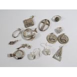 A collection of silver jewellery items to include silver and mother of pearl pendant, heart pendant,