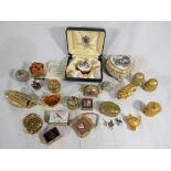 Approximately twenty pill and trinket boxes to include an enamelled Toye,