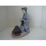 Lladro - a figurine entitled 'August Moon' depicting a Japanese girl / Geisha kneeling, # 5122,