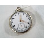 A white metal pocket watch, Arabic numerals on a white dial with subsidiary seconds dial, case 4.