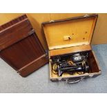 A Singer electric sewing machine with carry case and a vintage trouser press