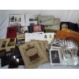 Deltiology - a quantity of all period postcards, photographs, cigarette and trade cards in albums,