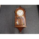 A German made, Arts and Crafts styled drop-dial wall clock,
