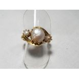 A lady's 18 carat yellow gold antique pearl crossover ring, size M, approx. 5.