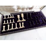 A late 19th / early 20th century carved ivory and ebonized chess set, size of king 6 cm,