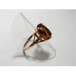 A lady's 9 carat yellow gold dress ring set with a large brown stone, size R, approx. 2.