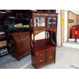 An early 20th century Art Nouveau Liberty style marquetry inlaid mahogany side cabinet of tall and