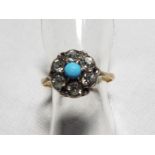 A lady's 9 carat gold and silver turquoise and white stone ring,