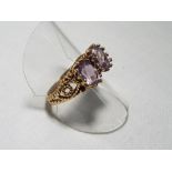 A lady's 9 carat rose gold fancy two stone amethyst dress ring, size R, approx. 4.