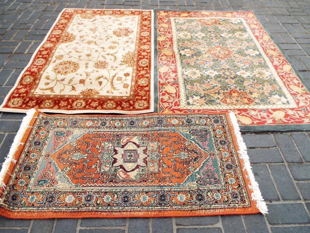 Three good quality rugs measuring approx 68cm x 35cm,