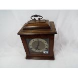 A good quality walnut cased English bracket style mantel clock,