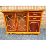 A good quality rosewood sideboard with astral glazed doors, 97cm x 148cm x 37.