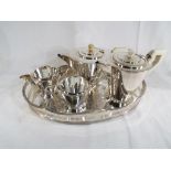 A modern plated tea set with serving tray