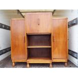 An oak drop front oak bureaux ca 1920's flanked with side by side shelves,