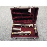 A clarinet by DY of the USA in original black hard case with Yamaha mouthpiece.