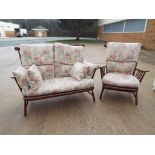 An oak framed modern upholstered spindle back settee and matching armchair by Ercol Est £50 - £70