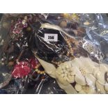 A sealed bag of costume jewellery