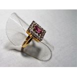 A lady's 9 carat yellow gold ruby and diamond cluster ring set with 18 eight-cut diamonds, size L,
