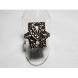 A lady's silver and marcasite dress ring,