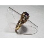 A lady's 9 carat yellow gold three stone dress ring set with cz and amethyst, size N, approx. 3.