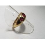 A lady's 9 carat yellow gold three stone ruby ring, size O, approx. 5.