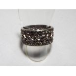 A lady's silver ring set with white gemstones,