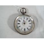 A lady's silver cased pocket watch, the case with engraved foliate decoration and stamped within .