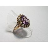 A lady's 9 carat yellow gold amethyst and seed pearl cluster ring, size N, approx. 5.