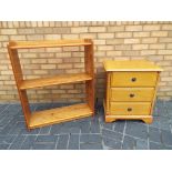 A pine bedside cabinet and a pine book case