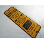 An original enamel sign marked 'Australian Post Office Warning underground telephone cables',