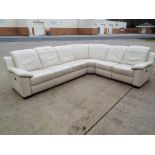 A good quality leather seven seater corner suite with electric recliners