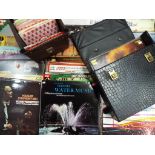 A large collection of records in carry cases to include Mozart, Percy Faith, the Sound of Music,