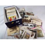 Over 600 early period UK topographical postcards to include real photos, animated street scenes,