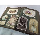 An early 20th century album containing in excess of 250 postcards of the period to include World