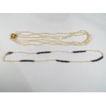 A triple stranded freshwater pearl neckl