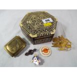 A wooden six sided trinket box inlaid wi