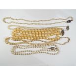 A quantity of pearl necklaces with silve