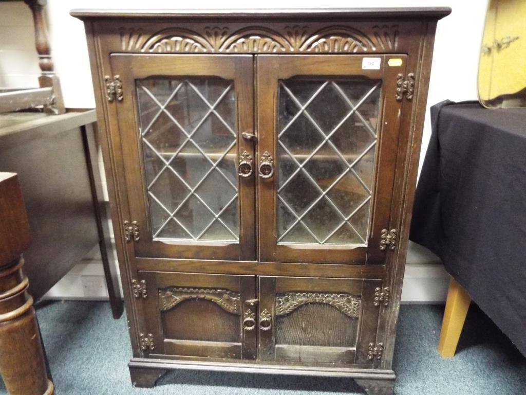 A Priory style oak corner cupboard and d